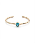 Twisted Gold Bangle with Oval Blue Topaz