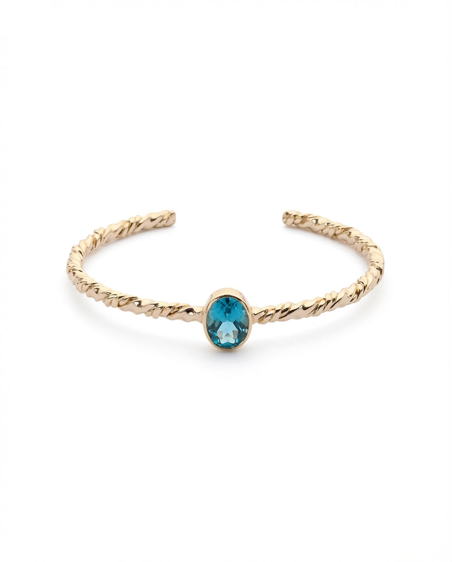 Twisted Gold Bangle with Oval Blue Topaz